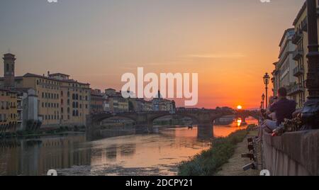 Sunset view from abridge in Florence Italy on a summers day Stock Photo