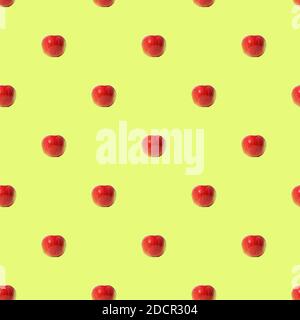 Seamless repeating pattern of red apples with green leaves and brown ...