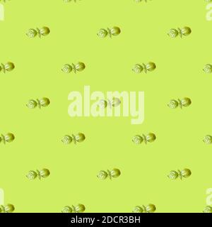 Seamless pattern of green leaves basil on a green background. Basil repeating ornament backdrop, Food eco banner. Stock Photo