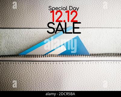 12.12 sale concept, credit card in the zipper of the wallet Stock Photo