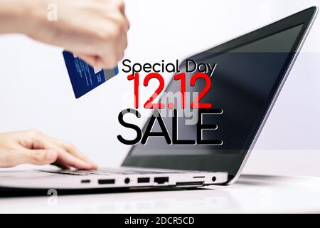 Hands holding credit card and using laptop. Online shopping Stock Photo