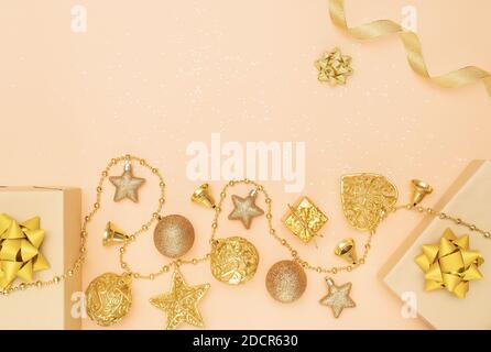 gifts boxes or presents boxes with golden bows, star and ball on golden background for birthday, christmas or wedding ceremony Stock Photo