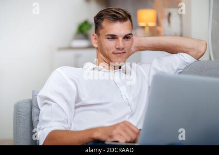 attractive young man using his laptop . people and technology. Stock Photo