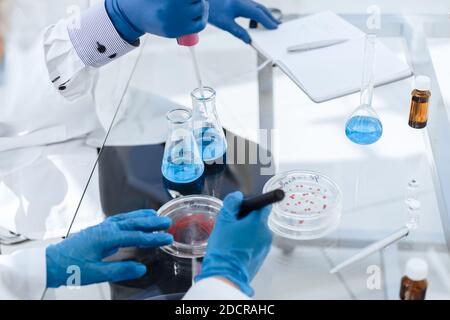 scientists conduct research in a microbiological laboratory. Stock Photo