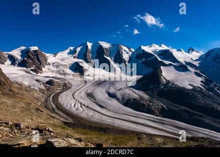 The summits of Piz Palü and Bella Vista and the Pers Glacier, seen from the cable car station and mountain hut Diavolezza. Stock Photo