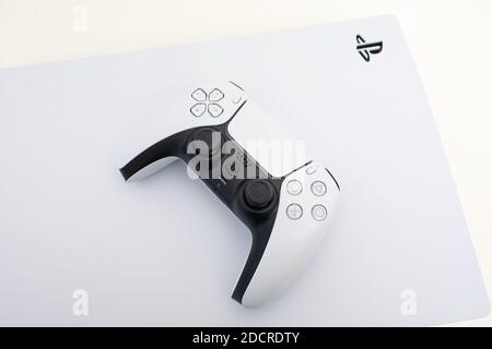 PlayStation 5 Sony reveals PS5 console and games. Dualsense controller.  Spider-Man: Miles Morales is PS5's biggest launch game. Man holding joystick  Stock Photo - Alamy