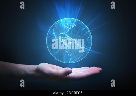 Man is holding glowing globe in hand. Global network concept. Stock Photo