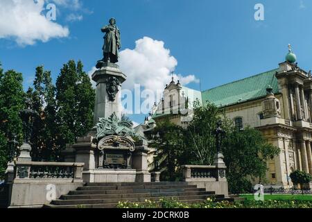 Warsaw, Poland - August 8, 2010: Warsaw old town and the Monument of Adam Mickiewicz Stock Photo