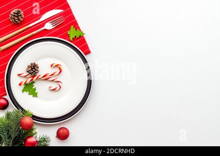 Flat lay of Christmas table setting with holiday decorations Stock Photo