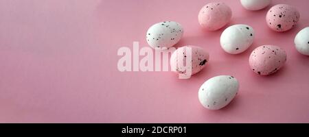 Pink easter banner, decorative eggs. Copy space for text. Stock Photo