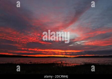 Dundee, UK. 23rd November, 2020. Sunrise over Invergowrie Bay near Dundee. A dramatic start to mild day in Tayside. Credit: Stephen Finn/Alamy Live News Stock Photo