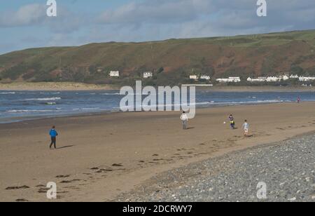 People walking and playing on the beach in Ynyslas at the Dyfi estuary, near Borth and Aberystwyth, Ceredigion,Wales,UK Stock Photo