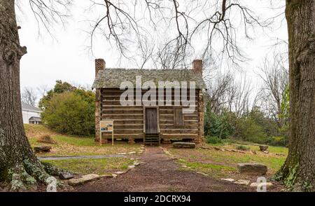 KINGS MTN, NC, USA-4 MARCH 2020: The Robert Barber house, built between 1810-1845, a log house setting in downtown. Stock Photo