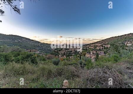 Beautiful view of the town of Deia, located in the Sierra de Tramuntana, a world heritage site, in Mallorca, Spain. Stock Photo