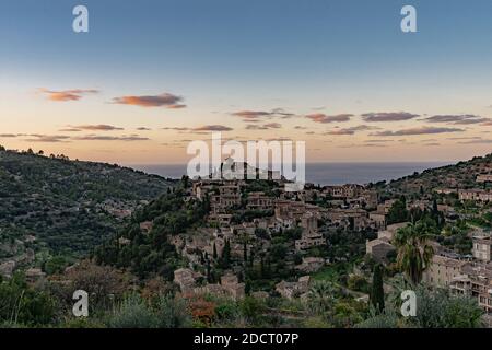 Beautiful view of the town of Deia, located in the Sierra de Tramuntana, a world heritage site, in Mallorca, Spain. Stock Photo