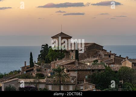 Beautiful view of the town of Deia, located in the Sierra de Tramuntana, a world heritage site, in Mallorca, Spain. Stock Photo