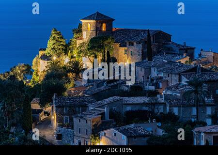 Beautiful view of the town of Deia, located in the Sierra de Tramuntana, a world heritage site, in Mallorca, Spain. Stock Photo