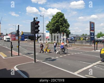 Cyclists and pedestrians use a new, segregated crossing on Lea Bridge Road, London, UK. Part of Waltham Forest's Mini Holland scheme for safer cycling Stock Photo