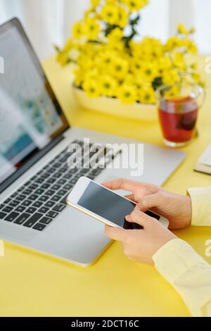 Businesswoman using mobile application Stock Photo