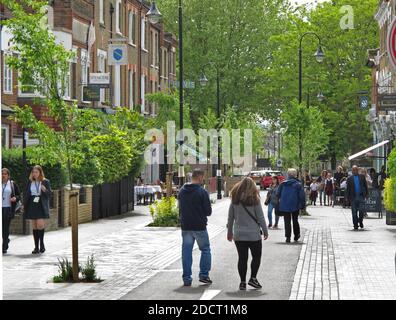 Pedestrians in traffic-free Orford Road, Walthamstow,London, UK. Newly pedestrianised shopping street, part of Waltham Forest's Mini-Holland scheme. Stock Photo