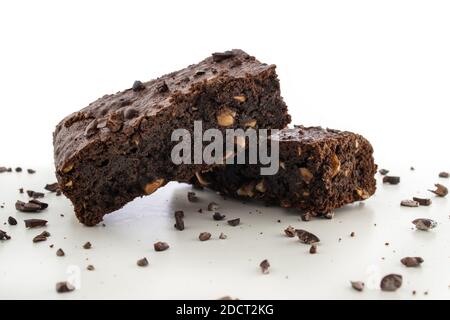 Brownie pieces on white background. Delicious chocolate pie. Stock Photo
