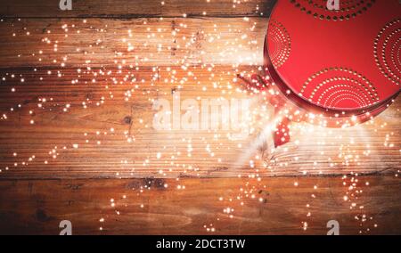 Magic Christmas box on wooden background. Stock Photo