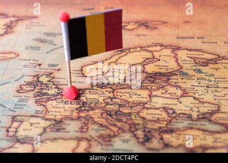 Belgium marked with a flag on the map. Flag of Belgium on the world map. The concept of travel and tourism. Stock Photo