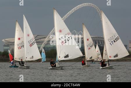 Laser class yachts racing on the Welsh Harp Reservoir, North London. The reservoir is the home of the Wembley Sailing Club and borders Wembley Stadium Stock Photo