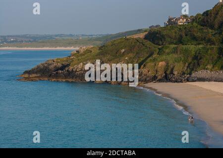 England / Cornwall / St. Ives / Aerial view of two people going to swim in the sea at Porthminster Beach , St Ives , Cornwall. Stock Photo