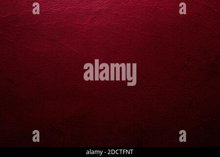 Crimson colored wall background with textures of different shades of red Stock Photo