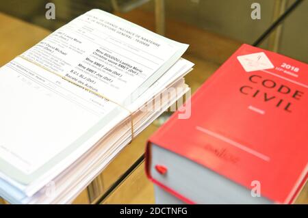 French civil code book with papers related to the trial between Johnny Hallyday's children, Laura Smet and David Hallyday against the singer's widow, at the Nanterre Regional courthouse in Nanterre, near Paris, on March 30, 2018. The Nanterre court was to consider an interim injunction filed by Johnny Hallyday's children over a posthumous album on March 30. Photo by Eliot Blondet/ABACAPRESS.COM Stock Photo