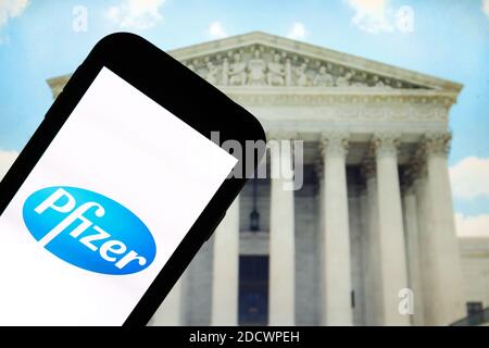 In this photo illustration a Pfizer pharmaceutical company logo seen displayed on a smartphone. Stock Photo