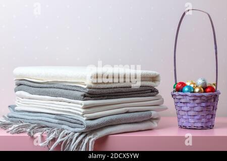 A stack of folded blankets, sheets and towels. Stock Photo