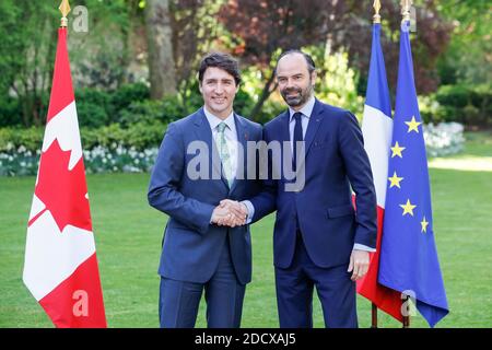 Canadian Prime Minister Justin Trudeau and French Prime Minister Edouard Philippe walk at the Hotel de Matignon, prior to a meeting on April 17, 2018 in Paris, France. Photo by Leon Tanguy/Pool/ABACAPRESS.COM Stock Photo