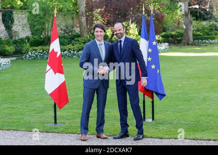 Canadian Prime Minister Justin Trudeau and French Prime Minister Edouard Philippe walk at the Hotel de Matignon, prior to a meeting on April 17, 2018 in Paris, France. Photo by Leon Tanguy/Pool/ABACAPRESS.COM Stock Photo