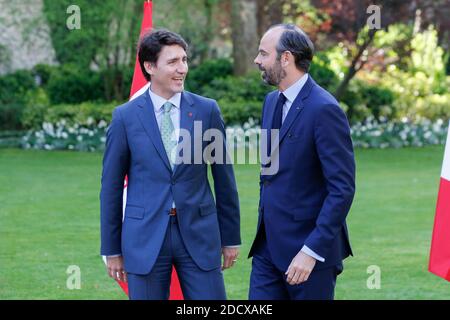 Canadian Prime Minister Justin Trudeau and French Prime Minister Edouard Philippe walk at the Hotel de Matignon, prior to a meeting on April 17, 2018 in Paris, France. Photo by Leon Tanguy/Pool/ABACAPRESS.COM Stock Photo