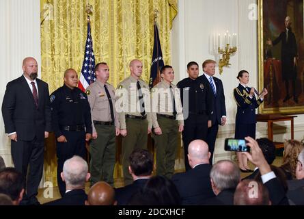 U.S. President Donald Trump presents the Public Safety Medal of Valor to (L-R) District Attorney Investigator Chad Johnson, San Bernardino County District Attorney's Office, CA; Detective Brian Olvera, San Bernardino Police Department, CA; Deputy Shaun Wallen, San Bernardino County Sheriff's Department, CA; Detective Bruce Southworth, San Bernardino County Sheriff's Department, CA; Corporal Rafael Ixco, San Bernardino County Sheriff's Department, CA; during an award ceremony at the East Room of the White House February 20, 2018 in Washington, DC. Photo by Olivier Douliery/Abaca Press Stock Photo