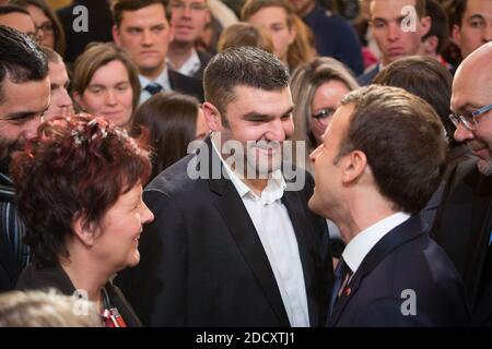 French President Emmanuel Macron discusses with guests next to the French President of the Young Farmers Association Jeremy Decerle after he delivered a speech to the new generation of French farmers invited at the Elysee Palace in Paris, France, on February 22, 2018. Photo by pool Hamilton/Rea/ABACAPRESS.COM Stock Photo