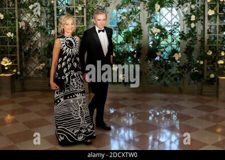 Bernard Arnault and Hélène Arnault arrives in the “Booksellers Area” of the  White House to attend a state dinner honoring France's President Emmanuel  Macron on April 24, 2018 in Washington, DC. Photo