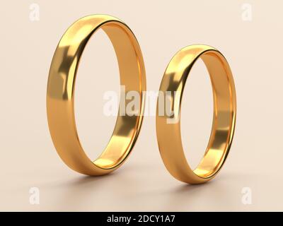 Two wedding gold rings lie next to each other. Love concept. 3d rendering Stock Photo