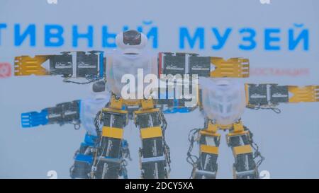 Humanoid robots dancing at robotic show Stock Photo