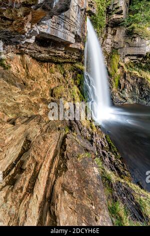 Flowing waterfall with interesting limestone rocks at Thornton Force in the Yorkshire Dales, UK. Stock Photo