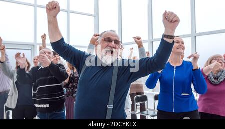 group of mature people applauding after meeting Stock Photo