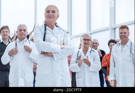 a group of doctors and recovered patients celebrate the victory Stock Photo