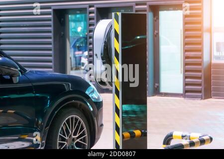 Refueling for electric cars e-mobility, the electric plug under voltage restores the battery charge Stock Photo