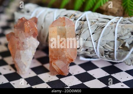 Beautiful quartz cluster, tangerine quartz. Orange healing crystal on display, bohemian vibes, minimalism witchcraft. Small crystal cluster, natural. Stock Photo