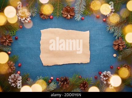 Christmas and Happy New Year dark blue background with craft paper for text and bokeh Stock Photo