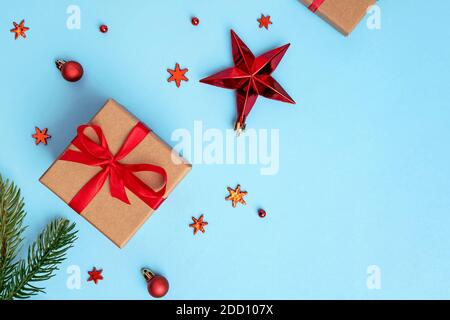 Red Christmas stars and snowflakes on blue background. Stock Photo