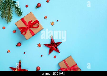 Red Christmas stars and snowflakes on blue background. Stock Photo