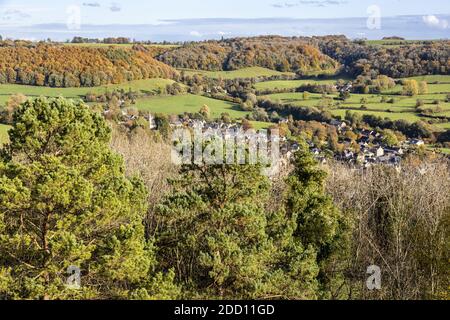 The village of Uley tucked in beneath the Cotswold escarpment viewed from Uley Bury, an Iron Age hill fort, Gloucestershire UK Stock Photo